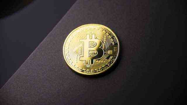 Gold coin Bitcoin on dark background. Cryptocurrency (BUTENKOV)