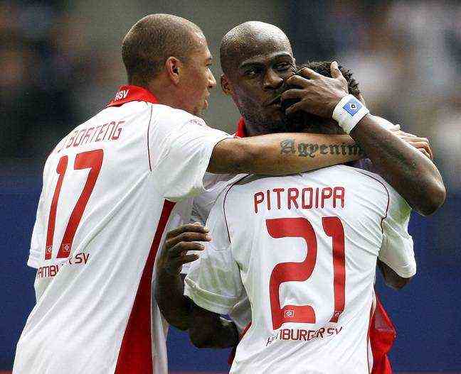 Jérôme Boateng and Guy Demel congratulate former Rennes player Jonathan Pitroipa on his goal scored in the Bundesliga meeting between Hamburg and Nuremberg in May 2010. 