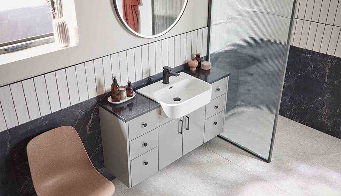 A bathroom in gray, black and white 