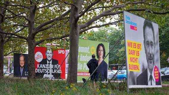 Election posters of the Union with Armin Laschet, the SPD with Olaf Scholz, from Bündnis 90 / Die Grünen with Annalena Baerbock and the FDP with Christian Lindner stand in a row one day after the general election.  