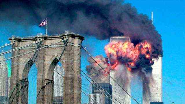 Over the Brooklyn Bridge, the second plane can be seen exploding in the World Trade Center.