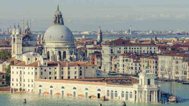 Punta della Dogana and Santa Maria della Salute standing at the meeting point of the Grand and Giudecca canals, Venice,