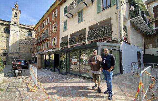 Nicolas (on the left) and Guillaume in front of the restaurant Le Biancheri one year after the storm Alex which had devastated the facade