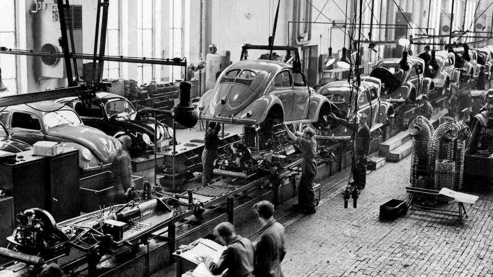 The VW Beetle quickly became a symbol of the economic miracle.  Photo from 1952.