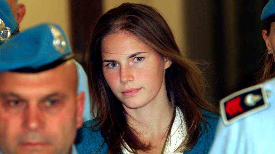 Amanda Knox is taken to Perugia Court by Italian law enforcement officers.
