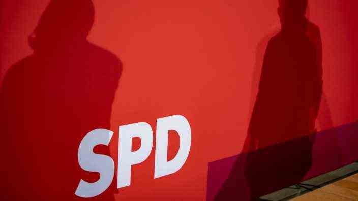 The shadow of the co-party chairmen of the SPD Norbert Walter-Borjans and Saskia Esken during a press conference in