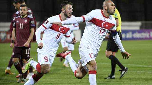 Stefan Kuntz in Turkey: The moment that let the tears run free: Burak Yilmaz, right, converted a penalty in the 99th minute of the World Cup qualifier against Latvia to give Turkey a 2-1 win.