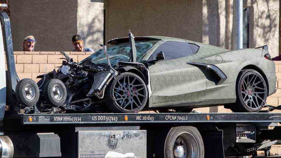 Henry Ruggs' completely destroyed Chevrolet Corvette is removed in a tow truck