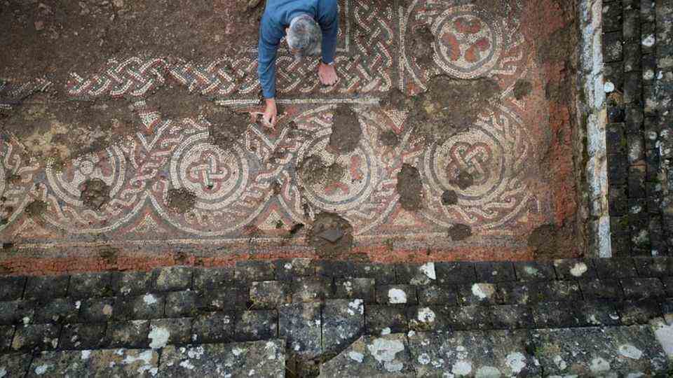 The mosaic is damaged in the center, but is better preserved on the edges.