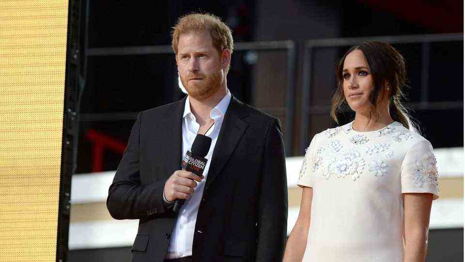 Prince Harry and Duchess Meghan on stage at "Global Citizen Concert"