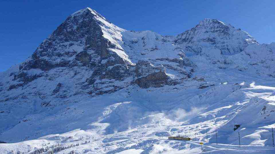 The Jungfrau Railway at the foot of the snow-covered north face of the Eiger.