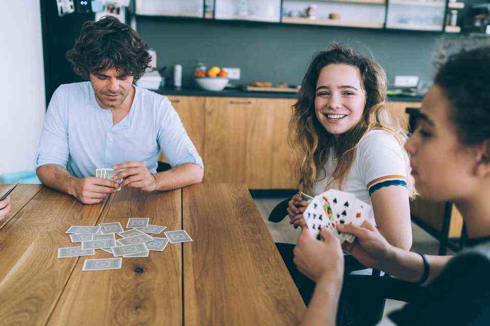 Young people playing cards