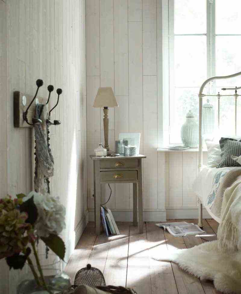 A white paneled bedroom 