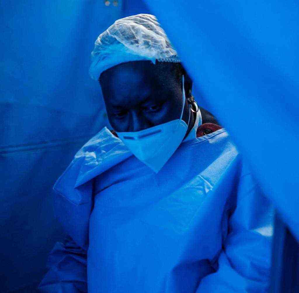 A nurse prepares for an operation in the Covid-19 ward of a hospital in Tembisa