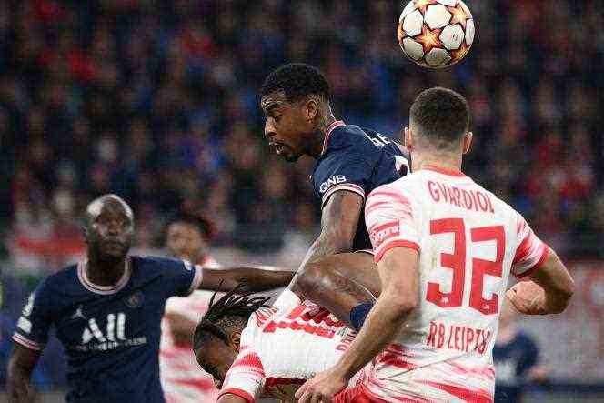 PSG defender Presnel Kimpembe fouls Christopher Nkunku leading the penalty for RB Leipzig on Matchday 4 of the Champions League on November 3, 2021 at the Red Bull Arena in Leipzig.