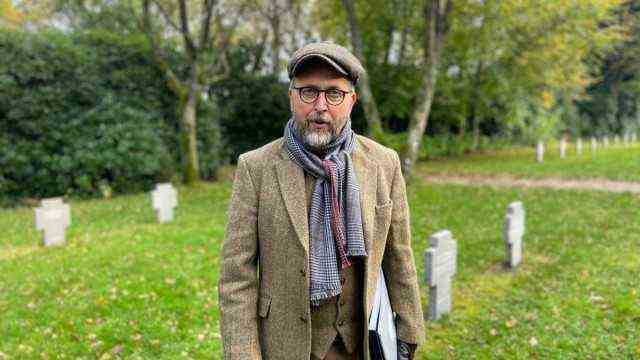 Attached are the photos of me, they show museum director Claus Kjeld Jensen at the cemetery of the German refugees from 1945-49 and in the construction site of the new camp museum building