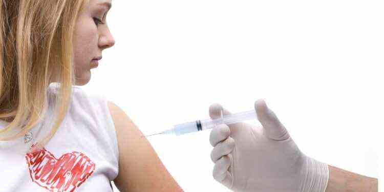 Adolescent receives vaccination in the upper arm