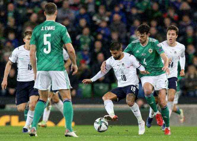 Northern Ireland defender Tom Flanagan and Italian striker Lorenzo Insigne during the 2022 World Cup qualifier in Belfast on November 15, 2021.