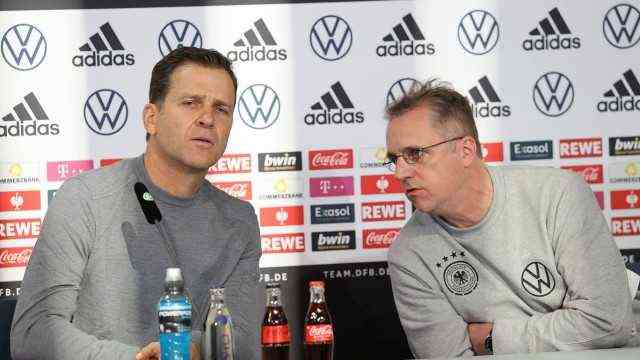 Oliver Bierhoff and team doctor Prof Dr ,.  Tim Meyer at the press conference DFL REGULATIONS PROHIBIT ANY USE OF PHOTOGRAPHS