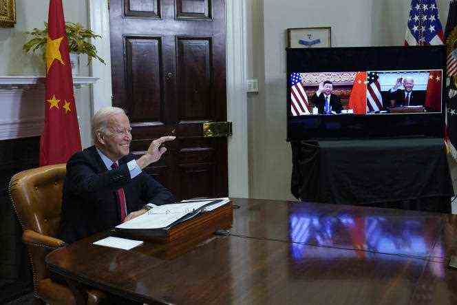 United States President Joe Biden greets Chinese President Xi Jinping during a video conference summit at the White House in Washington on November 15, 2021.