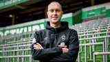 Werder's new coach Ole Werner poses with crossed arms in the Weser Stadium.