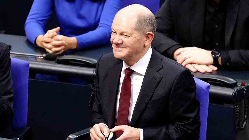 Olaf Scholz (SPD) is happy after his election as Federal Chancellor