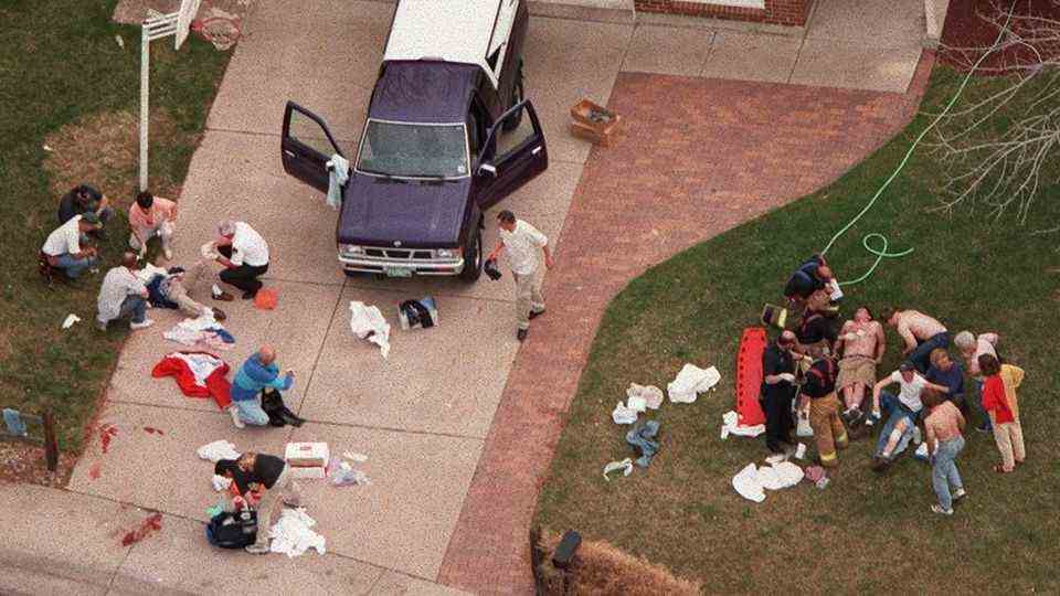 Injured people are cared for after the Columbine rampage