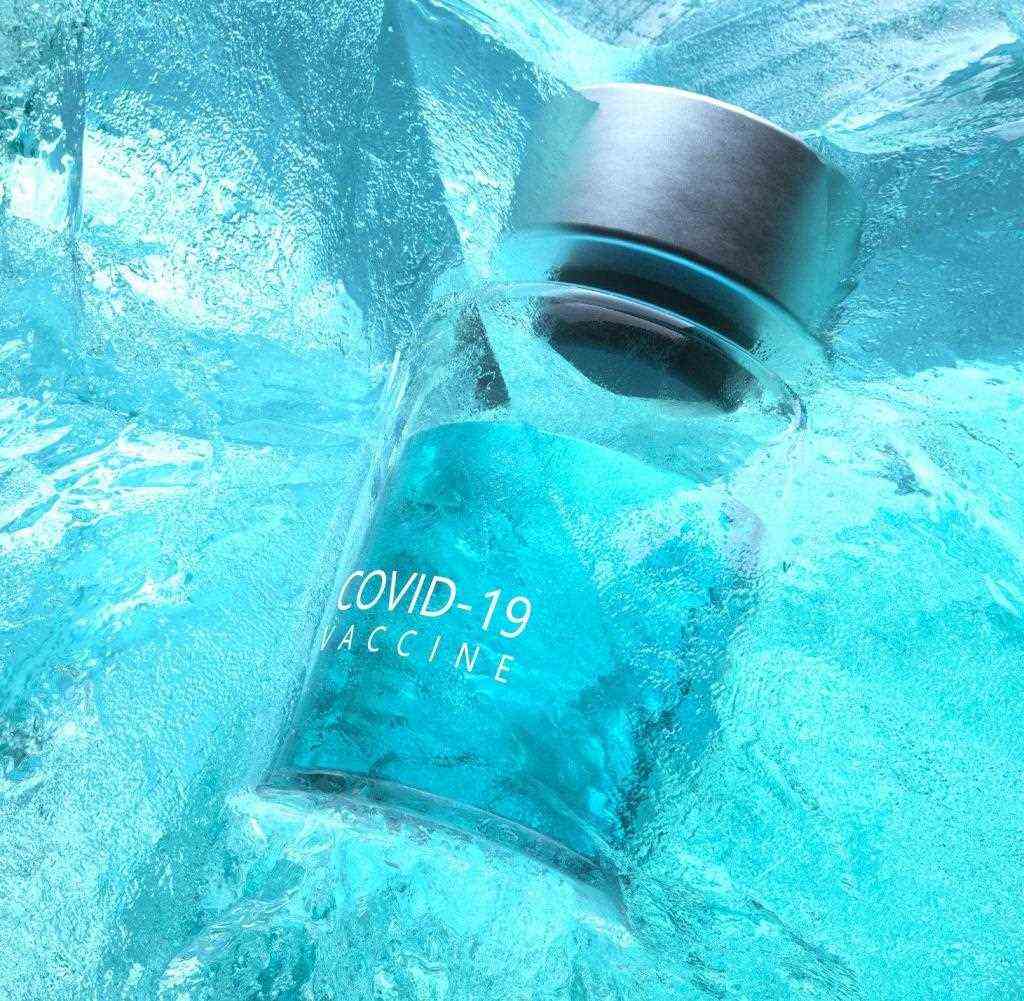 Digitally generated image of Covid-19 vaccine bottle frozen inside ice shape.