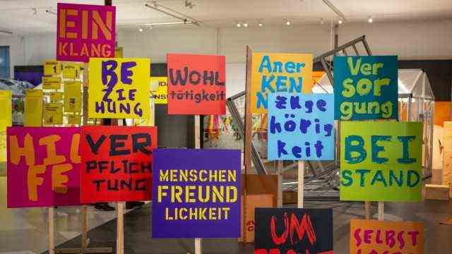 Exhibition: A forest of signs greets visitors at the entrance to the exhibition.