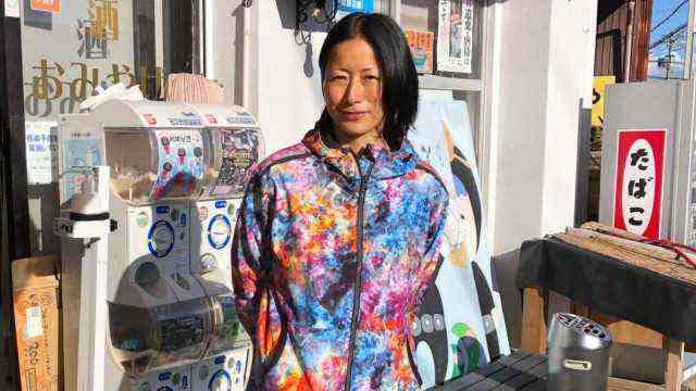 Japan: Ama diver Ayami Nakata in front of the shop that she runs with her mother.