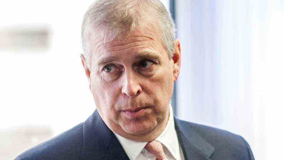 Prince Andrew with a depressed expression on his face