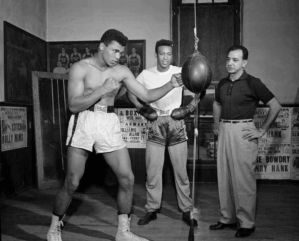 Cassius Clays training in Louisville in 1961: he is observed by trainer Angelo Dundee (right) and Jimmy Ellis (middle)