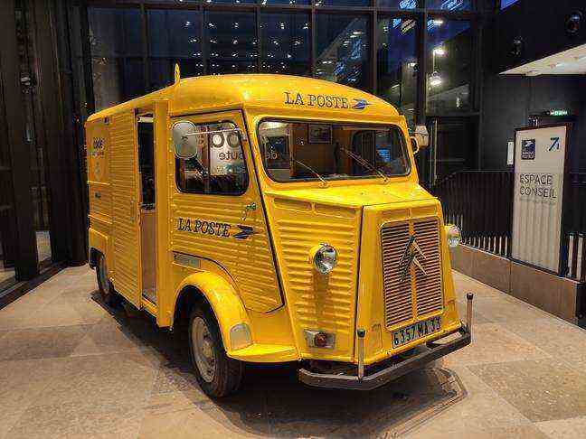 The yellow estafette, a former mobile office, sits proudly in the agency on rue de Louvre.