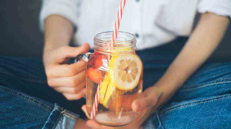 Drink more water!  A study has found that as little as a glass of water (500ml) before a meal satisfies cravings.