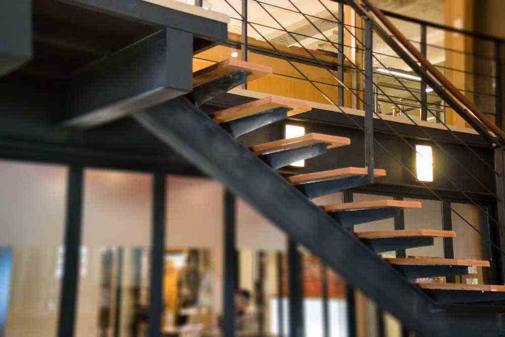 A Typical Industrial Staircase In Black And Wood 
