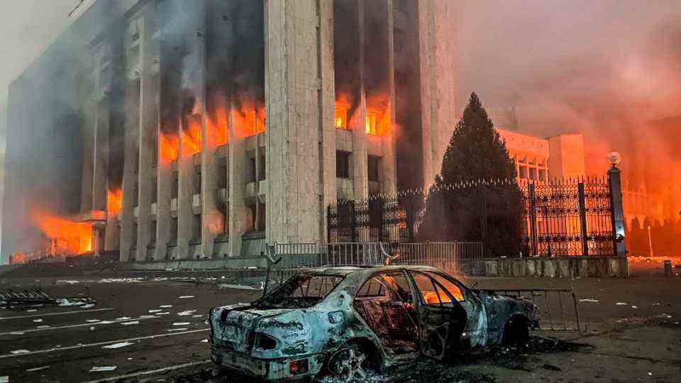 The burning building of the city administration in Almaty 
