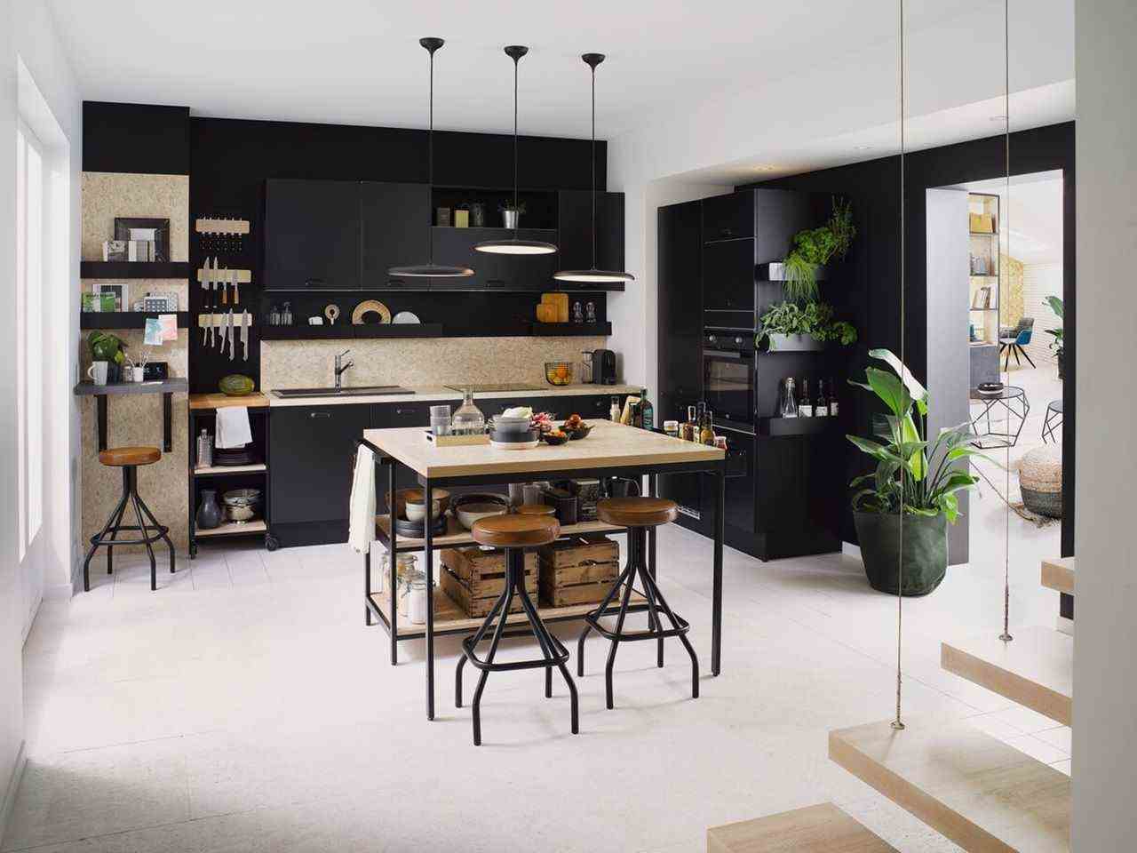 An Industrial Kitchen In Black And Osb