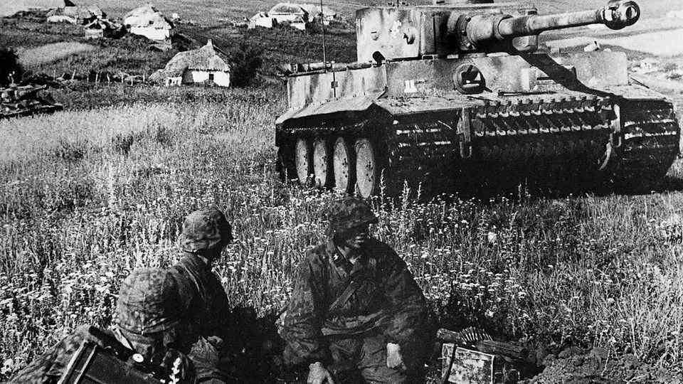 German Panzergrenadiers in front of a Tiger tank.