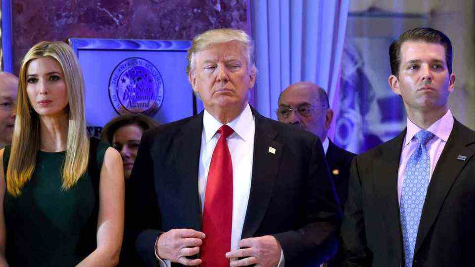Ex-US President Donald Trump (middle) and his daughter Ivanka and son Donald Jr. have to testify under oath about possibly fraudulent business practices