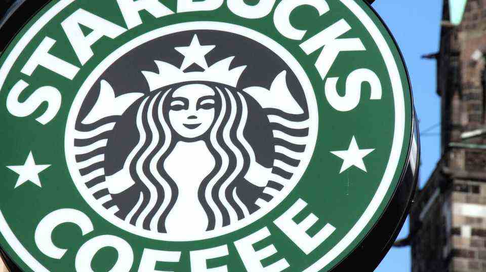 Das grüne Starbucks-Logo mit der schwarzen Nixe
