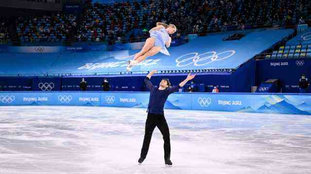 Figure Skating: Minerva Hase levitates in the air, Nolan Seegert gets her ready to catch her.  He later has to stop lifting because he lacks strength.