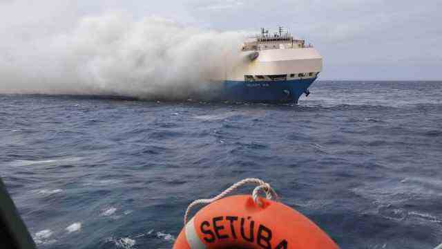 Ship fires: Plumes of smoke rise from the burning car freighter "Felicity Ace" up as seen from a Portuguese Navy ship.