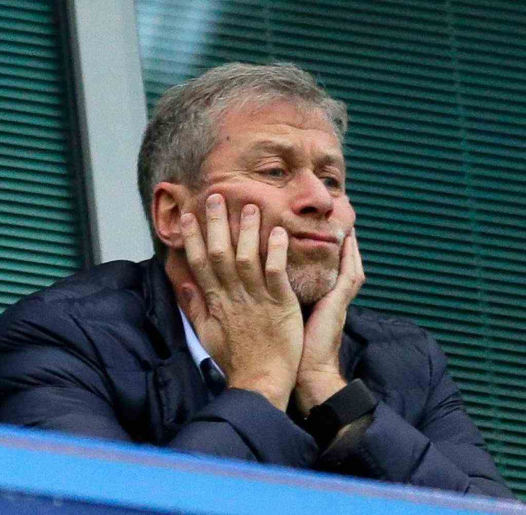 FILE - Chelsea soccer club owner Roman Abramovich sits in his box before their English Premier League soccer match against Sunderland at Stamford Bridge stadium in London, Dec.  19, 2015. Chelsea owner Roman Abramovich has on Saturday, Feb. 26, 2022 suddenly handed over the ‚Äústewardship and care‚Äù of the Premier League club to its charitable foundation trustees.  The move came after a member of the British parliament called for the Russian billionaire to hand over the club in the wake of Russia's invasion of Ukraine.  (AP Photo/Matt Dunham, File)