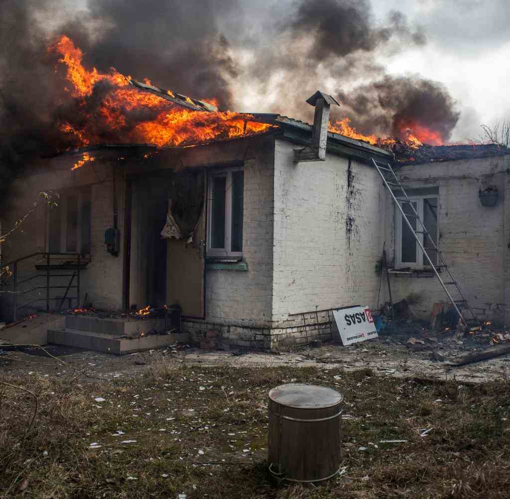A house burns after the shelling of the town of Irpin, west of Kyiv