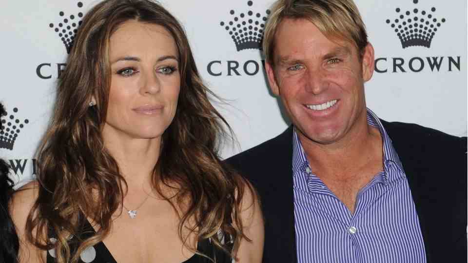 Liz Hurley and Shane Warne at an event in 2013