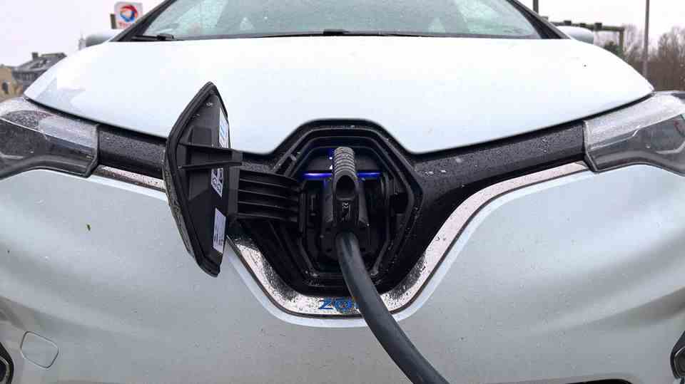 An electric car charges electricity using a charging cable
