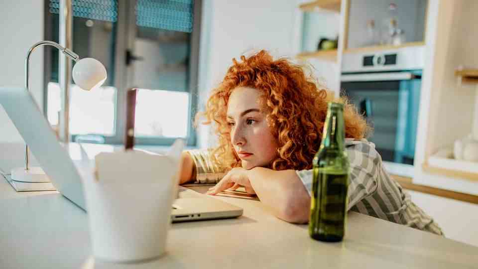 Woman works alone in front of the laptop