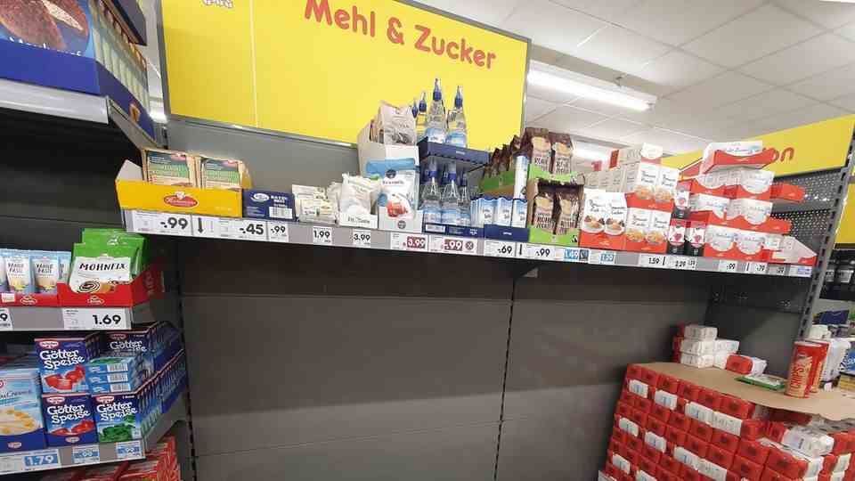 Supermarket shelf with sugar and flour