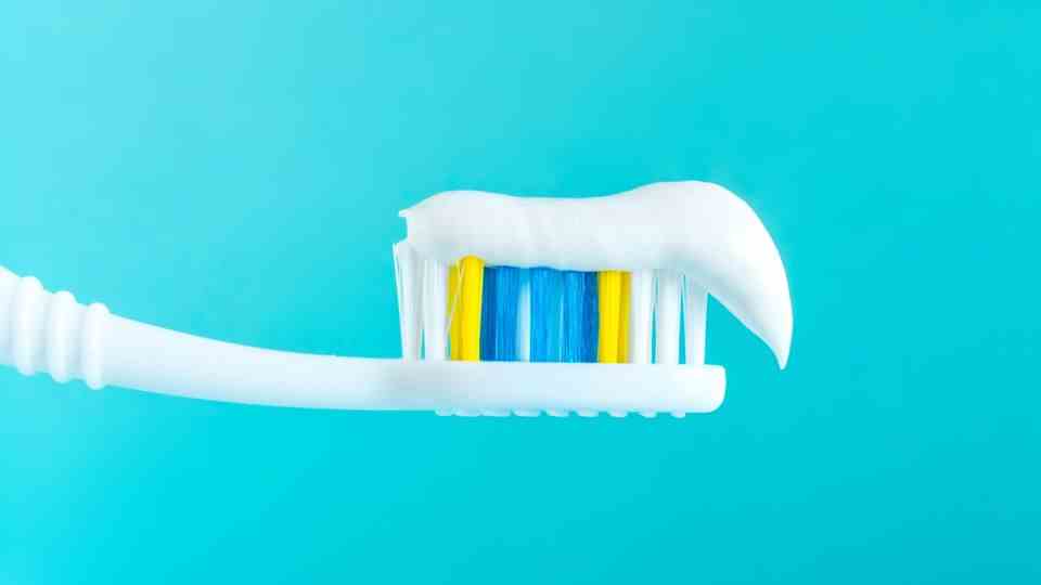 Toothbrush with toothpaste - many pastes contain fluoride