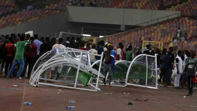 World Cup qualifiers in Africa: Spectators leave a trail of chaos at Nigeria's national stadium in Abuja.